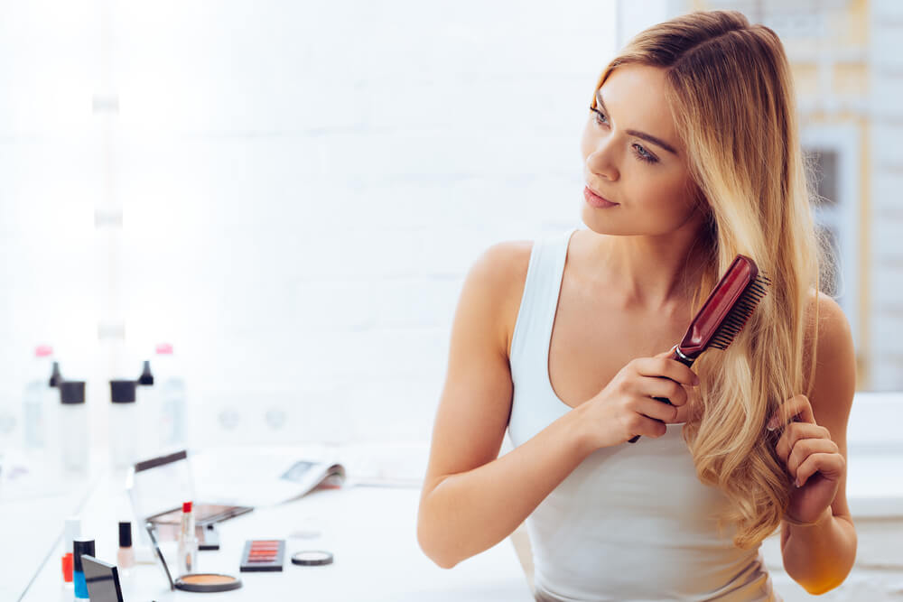 Woman brushing hair