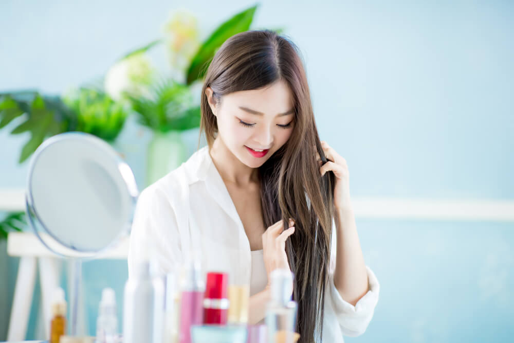 Woman touching hair