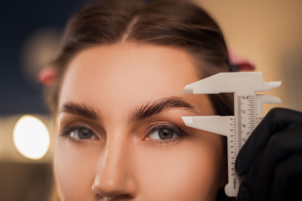 Woman having eyebrow treatment