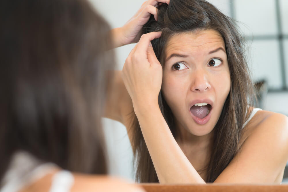 Woman finding gray hair