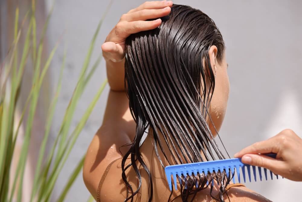 Woman using hair mask