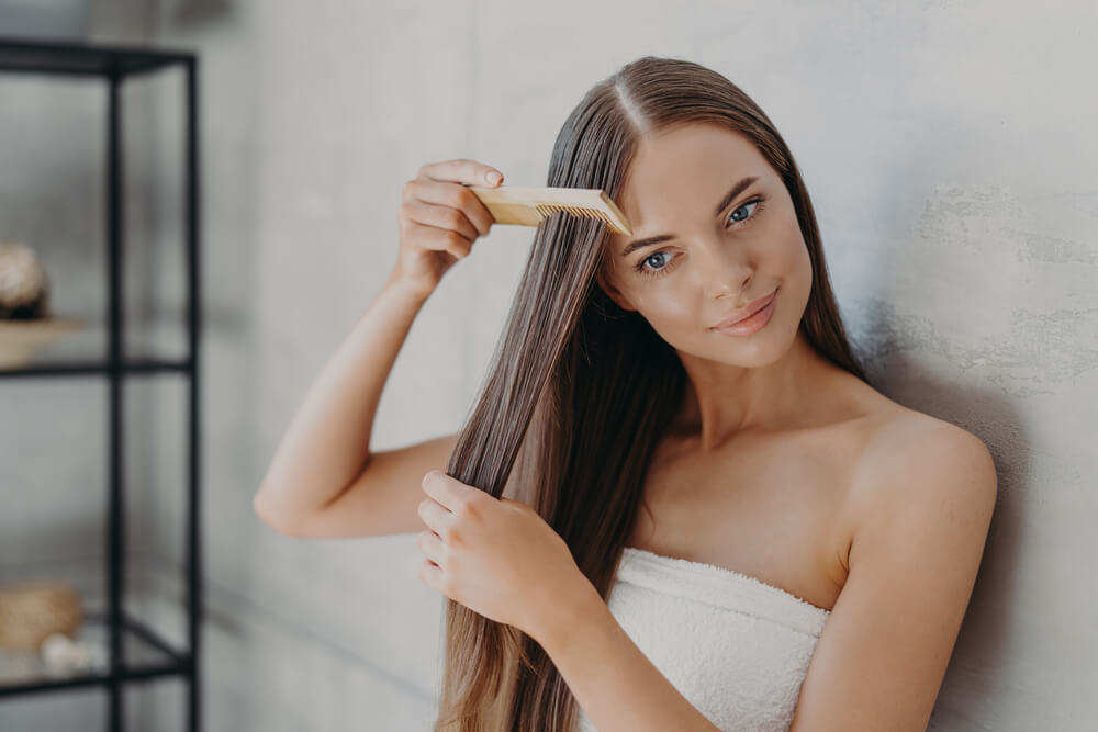 Woman combing hair