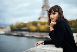 Woman in front of Eiffel Tower