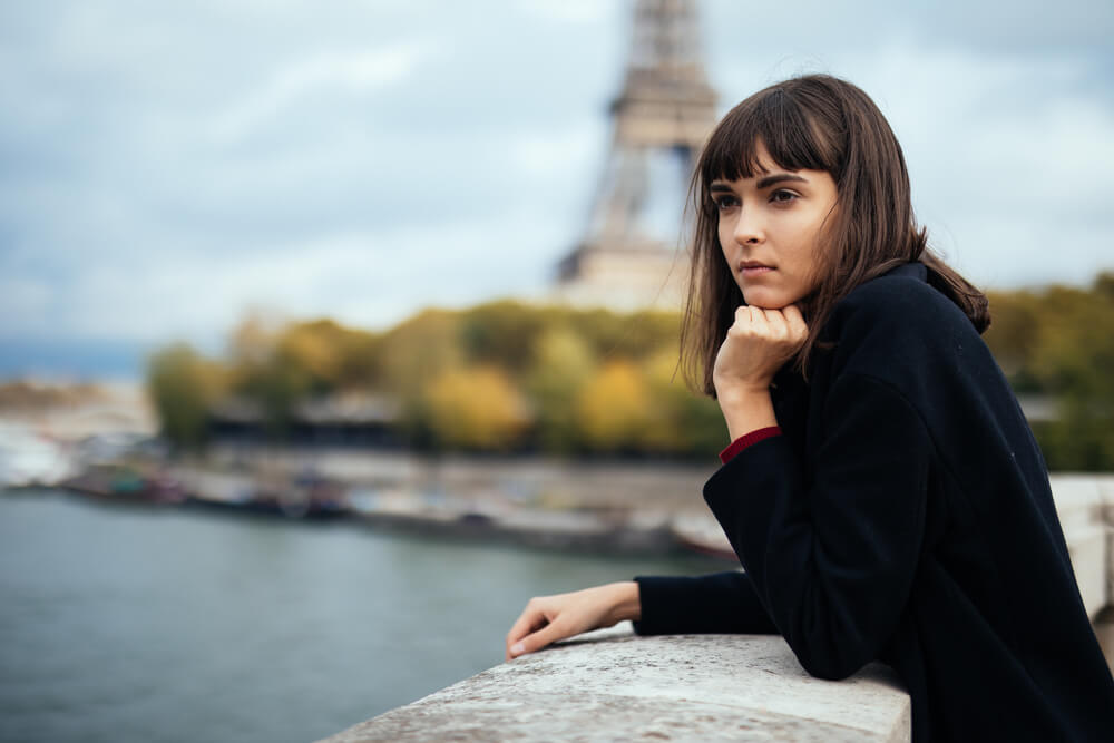 Woman in front of Eiffel Tower