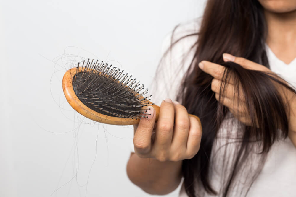 Woman brushing hair