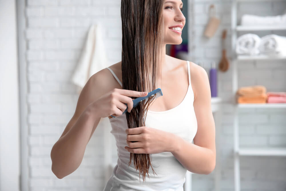 Woman combing hair