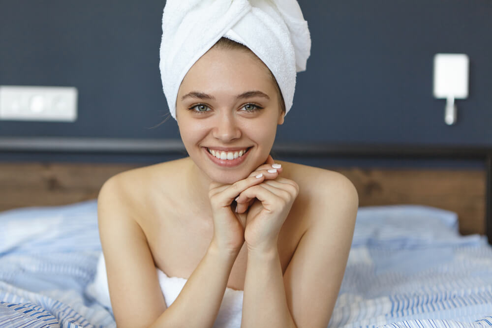 Woman showing how to use hair mask overnight