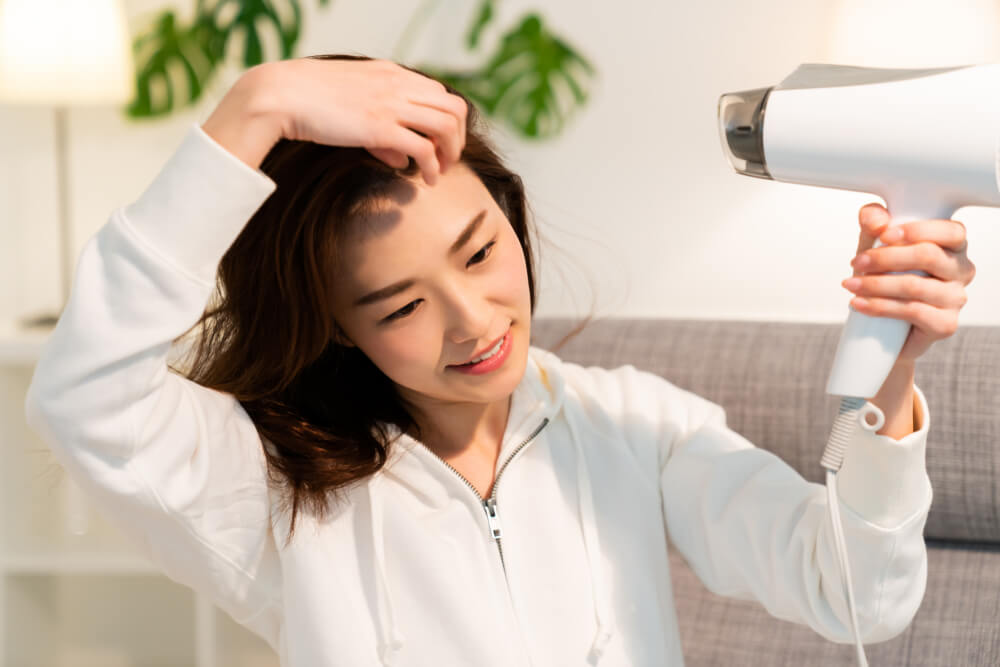 Woman drying hair