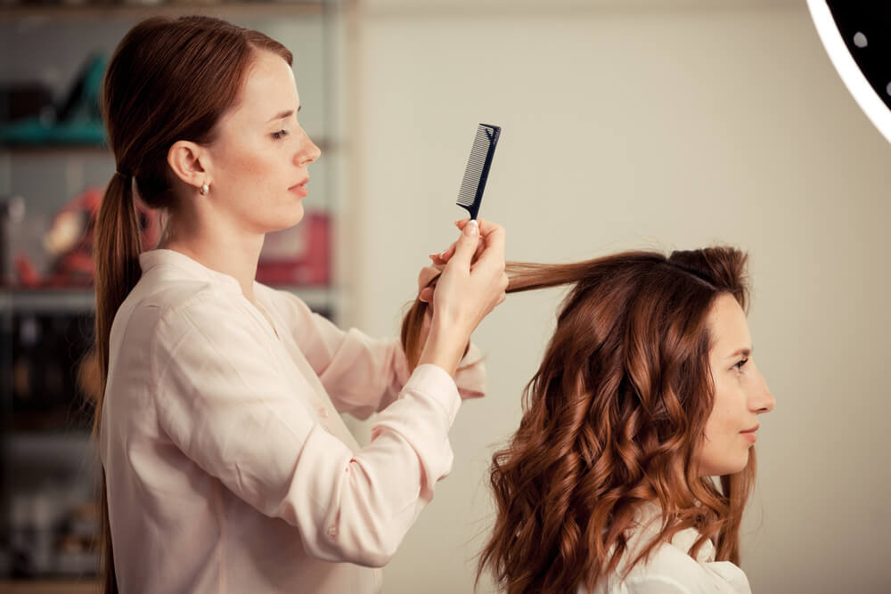 woman sectioning hair