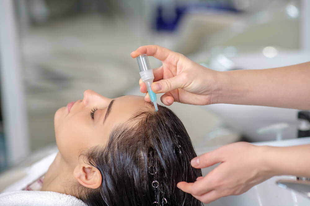 woman having hair washed