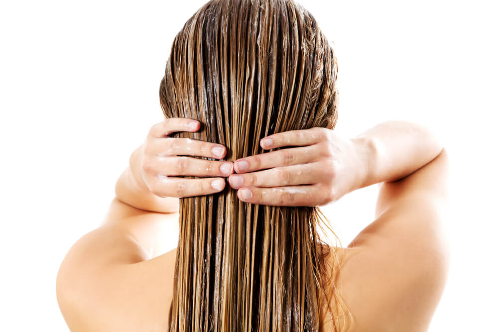 woman conditioning hair