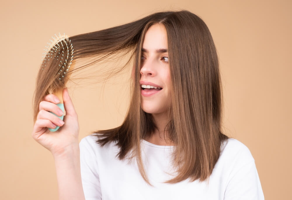 woman brushing hair