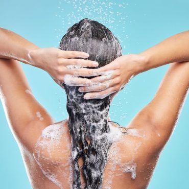 woman shampooing hair