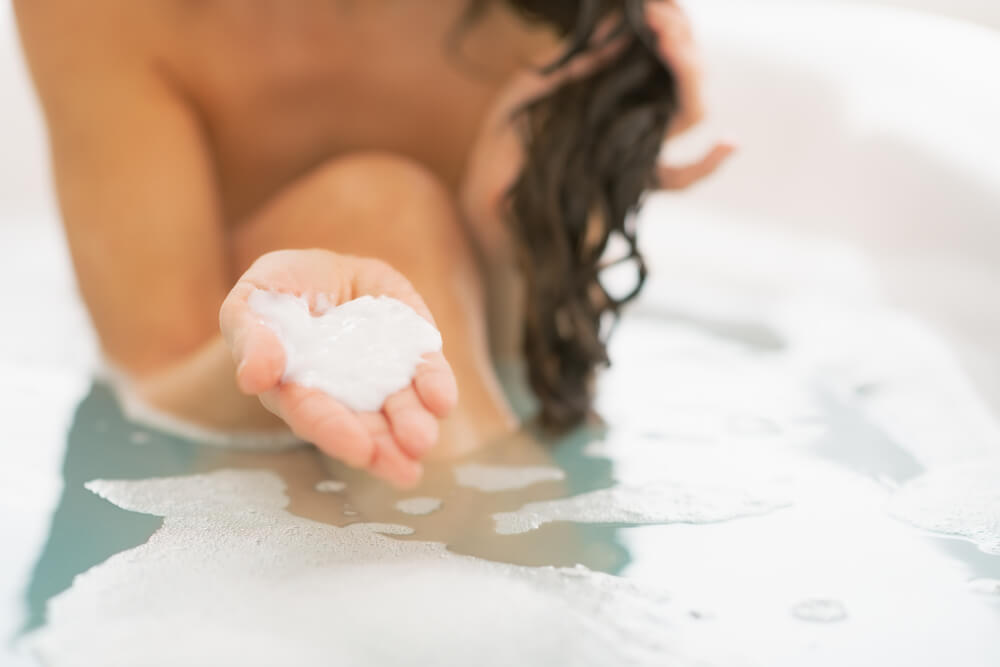 woman in bath with hair mask